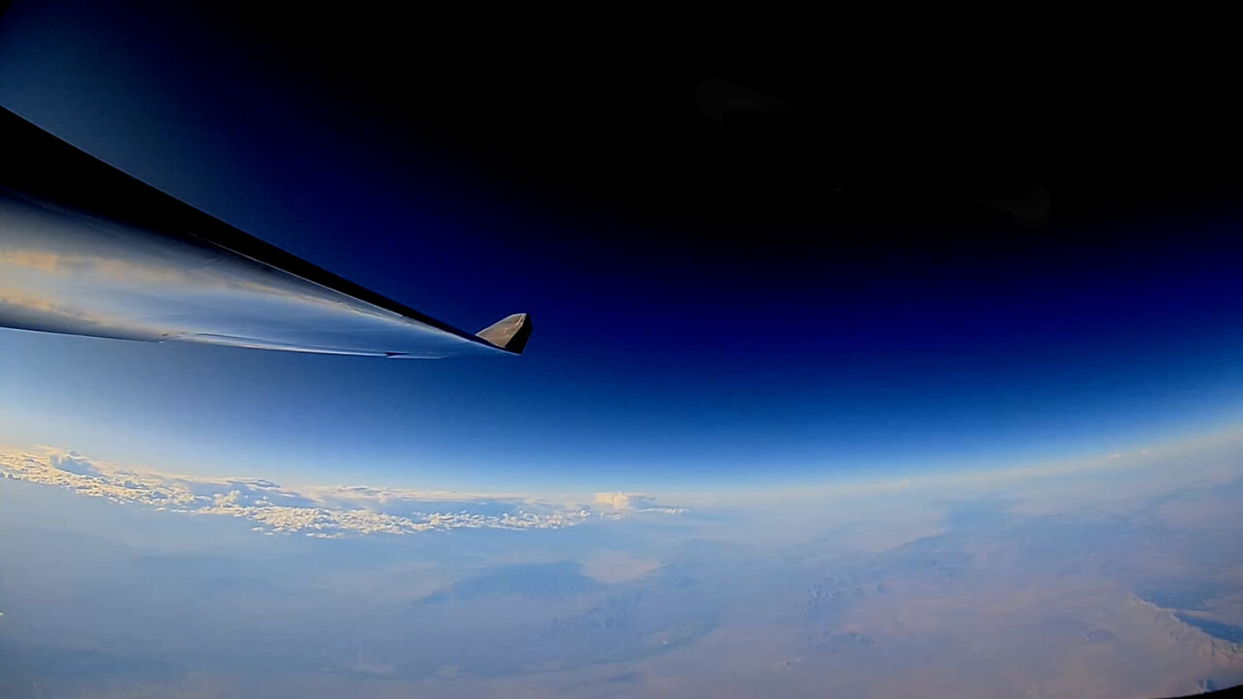 The wing of an aerial drone flying at height of 20,110 metres (66,000 feet).