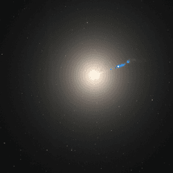 the galaxy is almost featureless just a bright central source that becomes more soofuse as it goes out. A bright blue thing jet is seen cutting across the galaxy like a ribbon